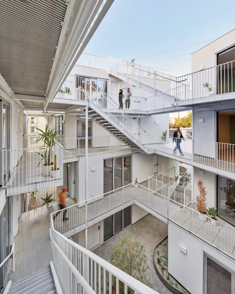 Open-stairwell courtyard at Comma Barrington.