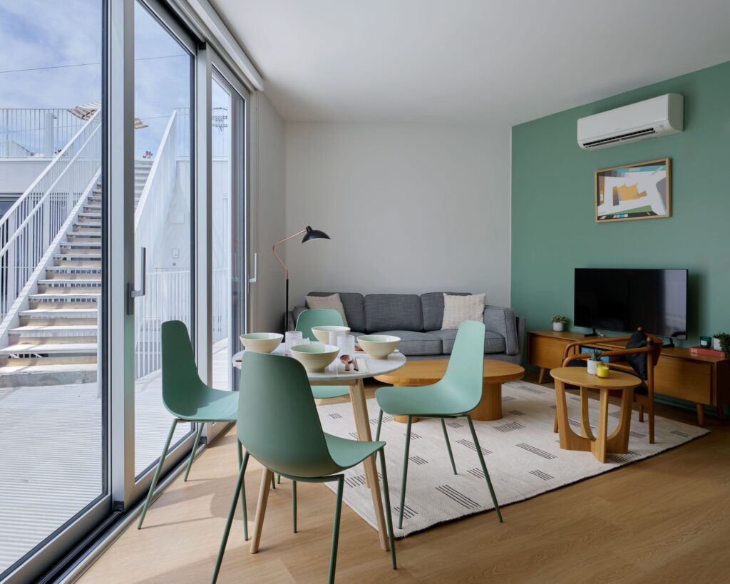 Shared living and dining area in a Comma Barrington unit.